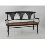 A Thonet ebonised bentwood settee, with three pierced and carved back splats, 146cm wide