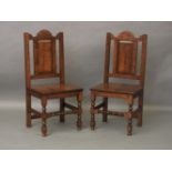 A pair of oak solid seat chairs