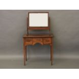 A George III mahogany dressing table, with inlaid top and tapering legs, together with a toilet