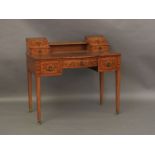 An Edwardian satinwood inlaid and leather top ladies writing desk, with letter compartments to the