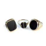 A 9ct gold gentleman's oval onyx signet ring, a gold onyx signet ring marked 9ct, a ladies gold onyx