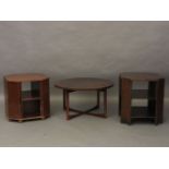An A H McIntosh circular occasional table together with an octagonal table drinks cabinet/