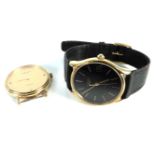 A gold plated gentleman's Longines quartz strap watch, with black dial and calendar aperture, with