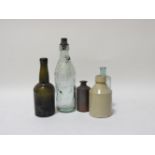 A collection of approximately thirty vintage coloured bottles