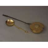 An 18th century brass and steel handled warming pan, 114cm long (later repairs) and a brass skimmer
