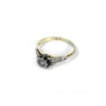 A gold single stone diamond ring, marked 18ct and plat, 2.16g