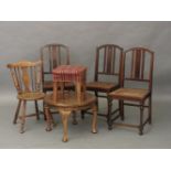 A walnut circular low table, an incised stickback chair, a walnut stool, and three cane seated