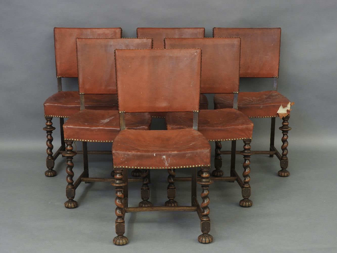 A set of six 1920s oak framed barley twist dining chairs, 50cm wide