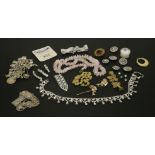 A silver charm bracelet, with a quantity of charms, a single opal tripet, a rose quartz necklace,
