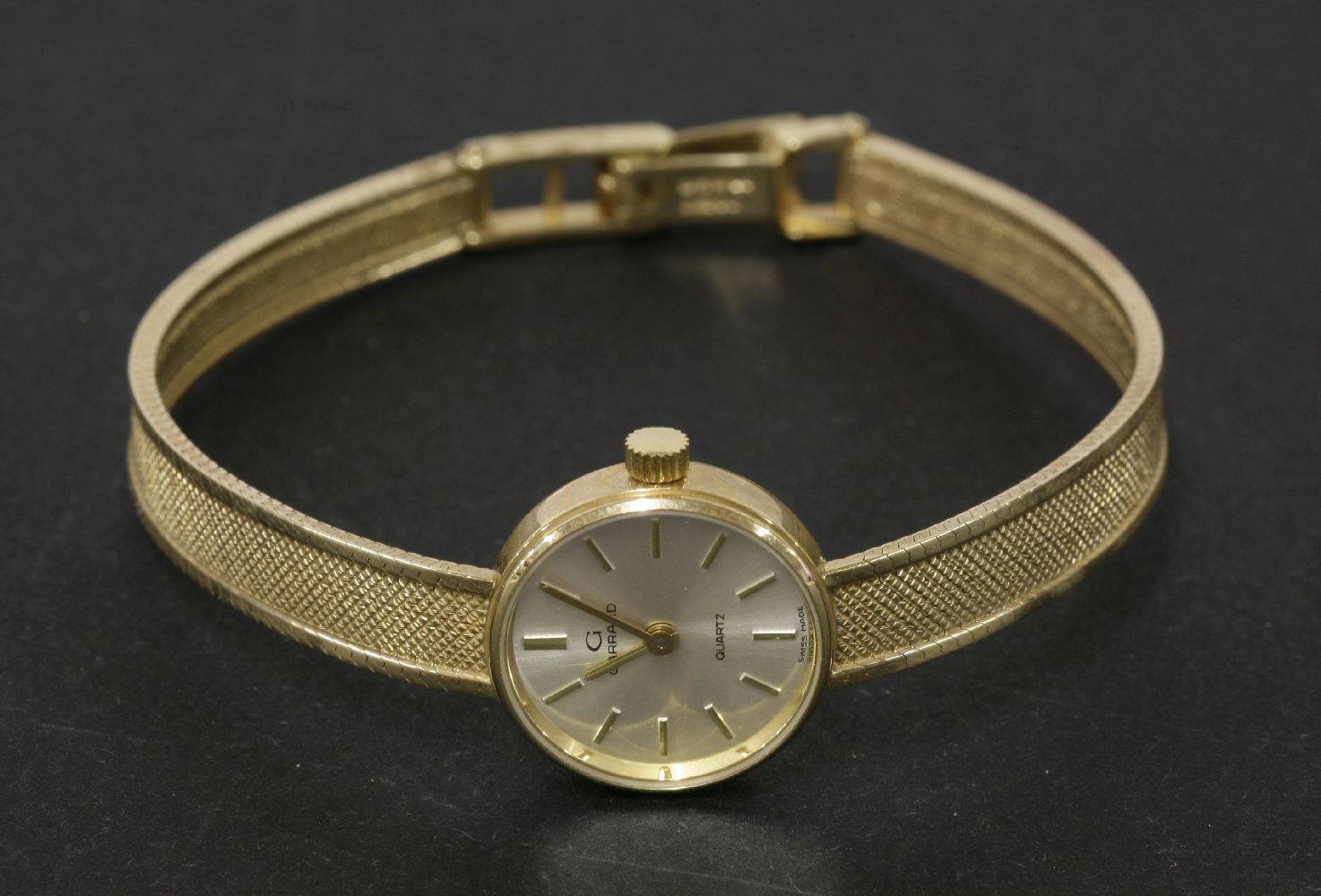A ladies 9ct gold Garrard quartz wristwatch, with paperwork, and original box, 16.01g