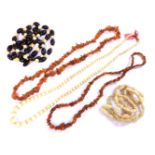 A quantity of ivory and amber chip bead necklaces, to include an early 20th century single row