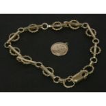 A gold twisted hoop and bar link bracelet, marked 375, together with a 9ct gold St Christopher