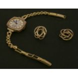 A ladies 9ct gold mechanical watch head, with silvered dial and Arabic numerals, with a later gilt