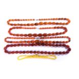 A collection of early plastic bead necklaces, to include four assorted single rows of early