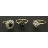A 9ct gold sapphire and cubic zirconia ring, a 9ct gold sapphire cluster ring, one deficient, and