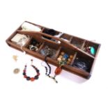 A rustic wooden tray of assorted loose beads and jewellery, and two further quantities of assorted