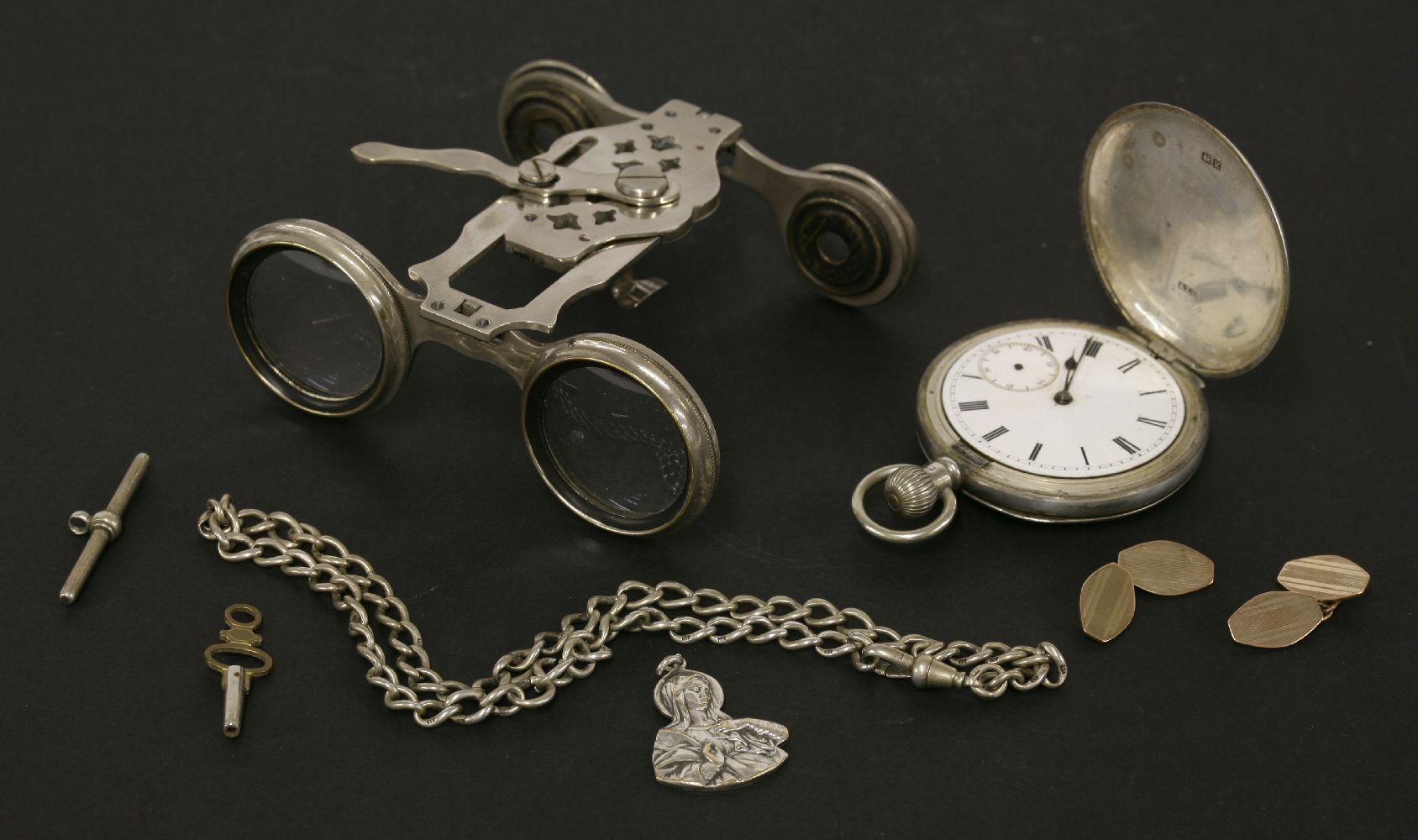 A sterling silver hunter pocket watch, with monogram and hand engraved roundel case, bezel and glass