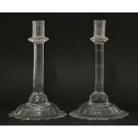 A pair of cut glass candlesticks,18th century, with facet cut stems and petal bases, shaped pontil