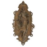 A Black Forest wall plaque, late 19th century, carved with dead game, the edge with oak and acorn