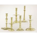 Six various brass candlesticks,early to mid-18th century, all of varying height, three with wide