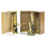 Two brass students' microscopes,boxed,16 and 15cm high (2)