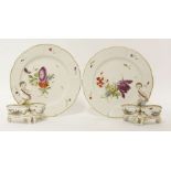 A pair of Ludwigsburg porcelain plates,each with a basketwork border, painted with a flower spray