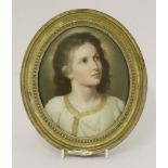 A KPM porcelain plaque,19th century, portrait of a young Jesus, 19 x 15cm, in an oval gilt frame
