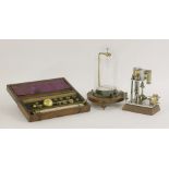 A Sikes hydrometer,in a strung mahogany box, with an ivory-mounted plaque thermometer,case 24cm