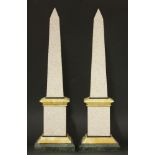 A pair of decorative granite and marble obelisks,each approximately 49cm tall (2)