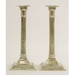 A pair of paktong candlesticks, early 19th century, of Corinthian column form, the removable sconces