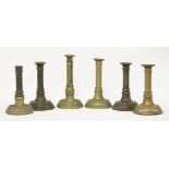 Six Victorian brass candlesticks, believed to be Military Academy examples,21cm high (6)