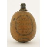 An unusual engraved West Indian nut flask,dated 1793, engraved 'Pat.k Mullen Jamaica 1793' within