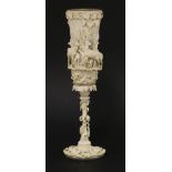 A German gilt metal and ivory cup,mid to late 19th century, the tall bowl profusely carved with