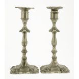 A pair of paktong(?) candlesticks,mid-18th century, with loose nozzles, one repaired,23.5cm high (