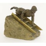 A patinated bronze,of a boy on a sledge, the brass sledge mounted on a wedge plinth, inscribed '