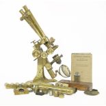 A Wenham's binocular lacquered brass microscope,by Ross, London, with adjustable rack, eyepiece,