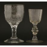 A large George III goblet, the round funnel bowl engraved with ribbon tied swags over a faceted stem