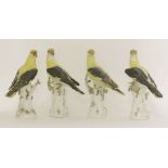 Four porcelain models of golden orioles,three Meissen and one Meissen-style, crossed swords marks,26