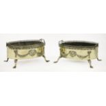 A pair of oval brass fireside baskets,late 19th/early 20th century, with a pierced gallery and