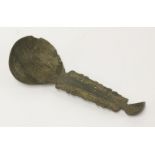 A horn double-end spoon,possibly Yurok, Native American, California, the pierced handle with bird-