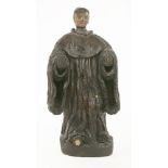 A carved figure of a saint,probably Spanish or Portuguese, the painted head re-attached, wearing
