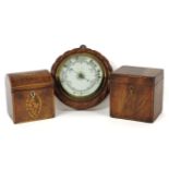 Two Georgian mahogany and burr yew wood tea caddies, 12 and 12.5cm wide, and an aneroid barometer,