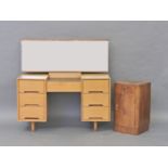 An oak Art Deco style dressing table, with ebonised centre section, flanked by drawers, together