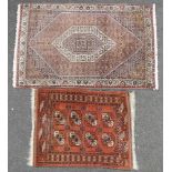 Two eastern rugs, approximately 173cm x 115cm and 114cm x 90cm