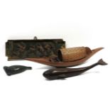 A North American slate carving of a seal, together a carved wooden whale, a wooden and wicker