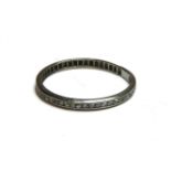 A channel set eight cut eternity ring, marked plat, cracked,