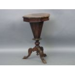 A Victorian walnut trumpet form work table, the hexagonal top on carved tripod base, 45cm wide, 77cm