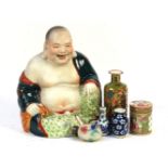A Peking glass snuff bottle, 20th century, with flower, a ceramic Budai with green robe, a Canon