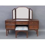 A G-Plan mahogany dressing table with raised mirrored back