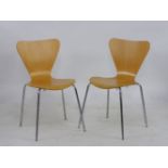 A pair of series seven chairs, designed by Arne Jacobson for Fritz Hanson